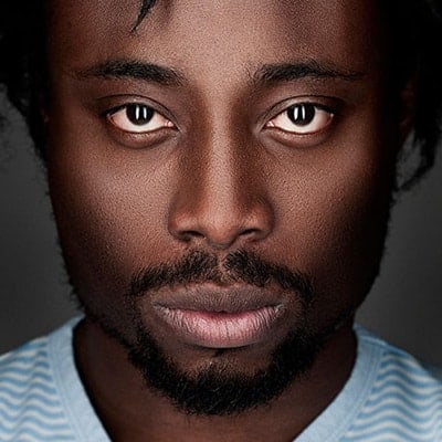 Close-up portrait of a man with a contemplative expression.